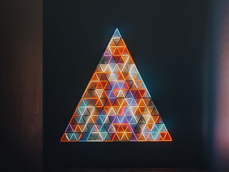 Technical writer for hire reviewing API documentation on dual monitor setup in Manhattan office